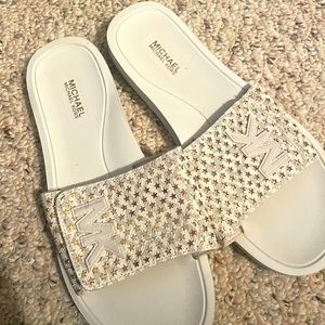 White and gold MK slides
